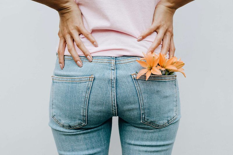 perimenopause women holding her hips due to menopause hip pain