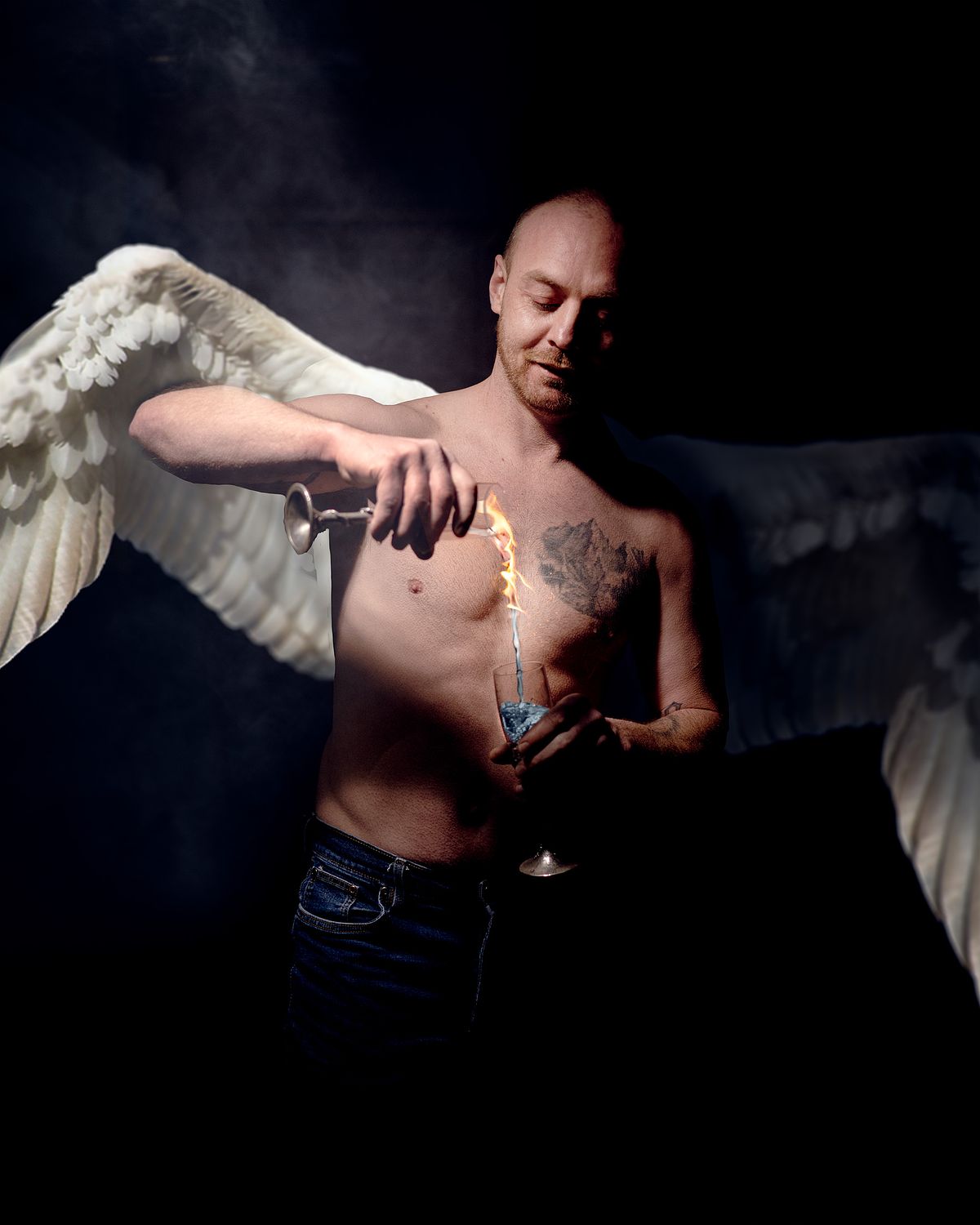 An angel turning fire into water as it pours from one goblet to another.