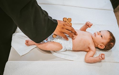 baby baptism ceremony at Ottawa church captured by Kameel Photography