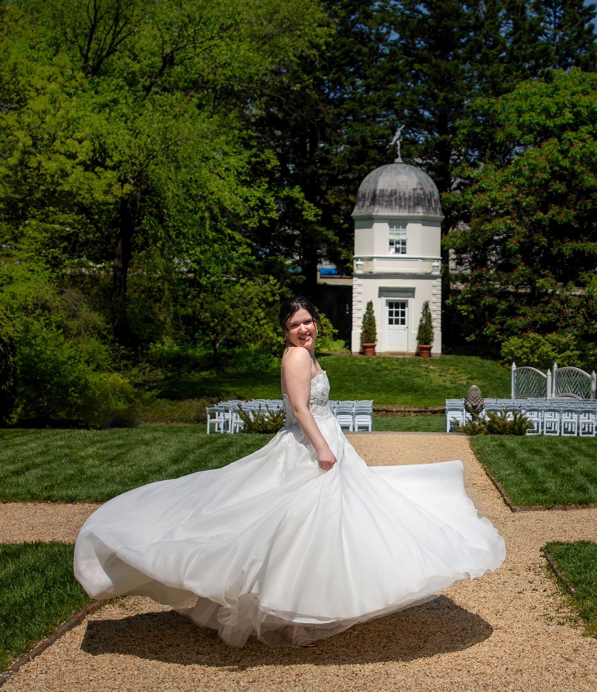 Bride dancing in the gardens at the paca house in annapolis, md