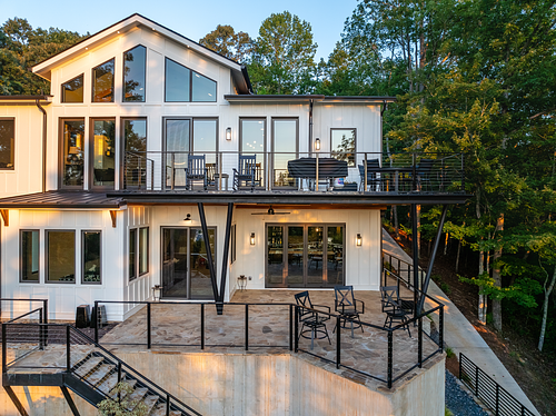 Overall view of steel deck; Upper deck off main level, covered lower deck off man cave and fun room