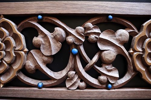 Walnut carving of swirling vines inspired by early Gothic and Scandinavian knotwork carving