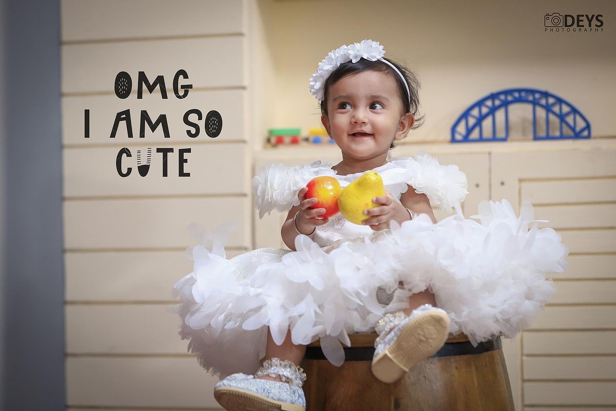 Cute baby smiling photoshoot at studio
