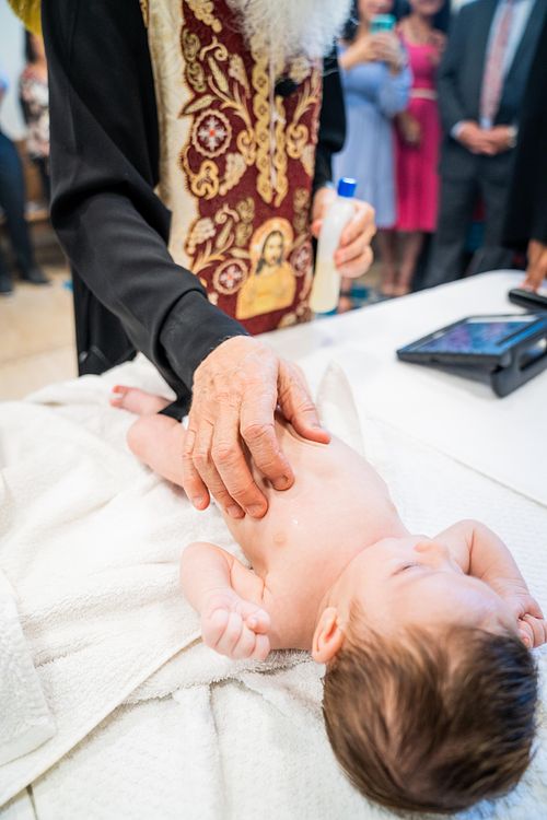 baby baptism ceremony at Ottawa church captured by Kameel Photography