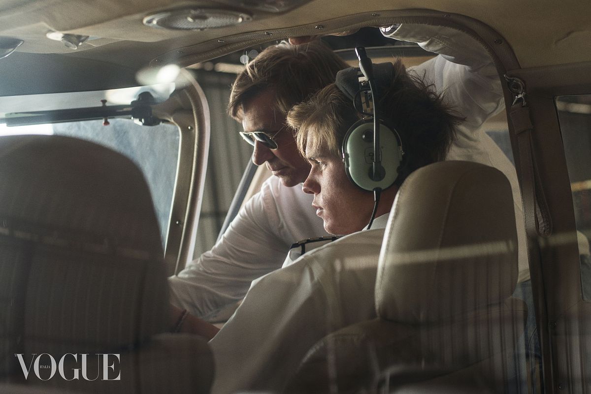 Portrait of two pilots in an airplane cockpit in a melancholic sepia style shot by Gabriel Matula.