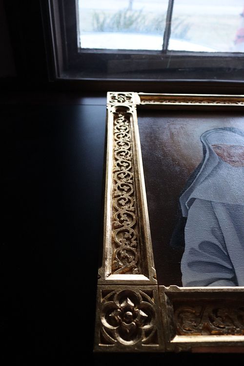 another side of the Dominican Sisters' picture frame in good raking light, showing off the lustre of the gold leaf