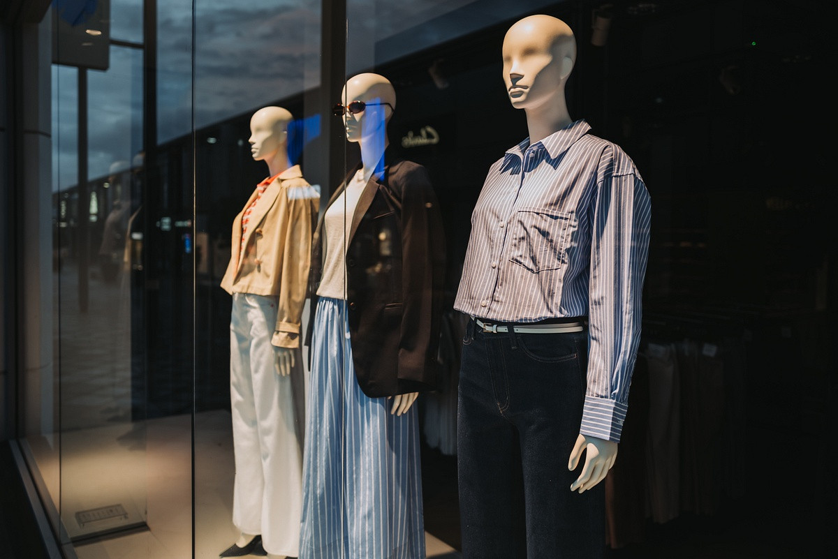Clothes models in window display water gardens Harlow