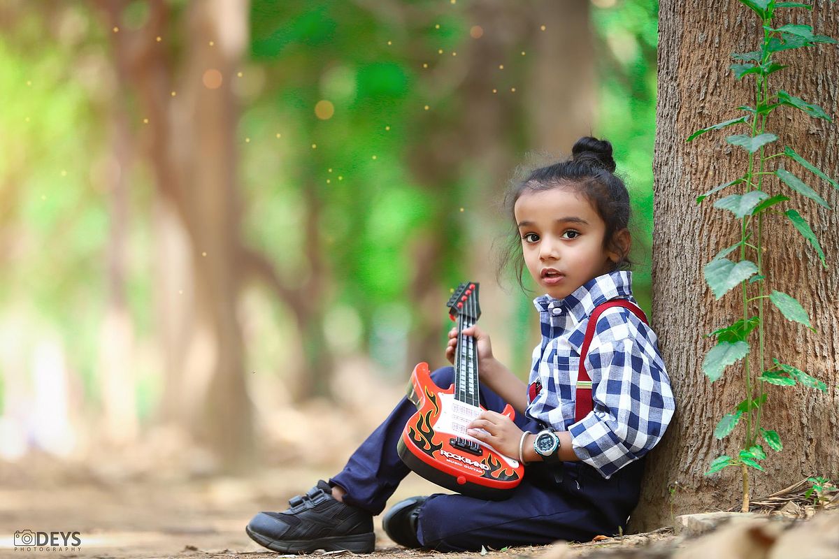 Kids shoot with guitar