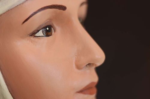Close image of St Rose's face after restoration