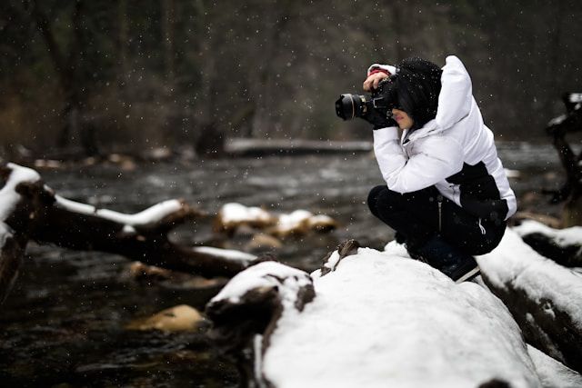 photographer clicking pictures during snow