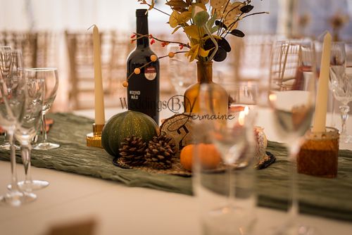 Beautiful wedding decor, showcasing elegant floral arrangements, table settings, and other details, captured by Weddings By Jermaine.