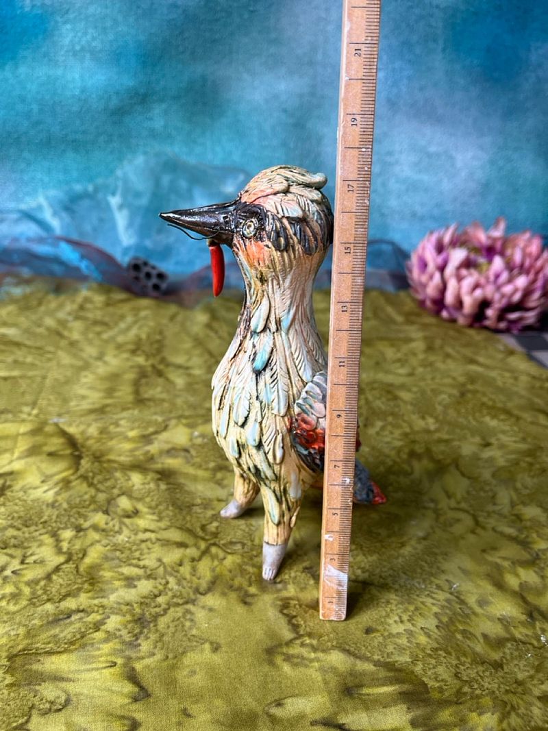 Woodpecker with a prey