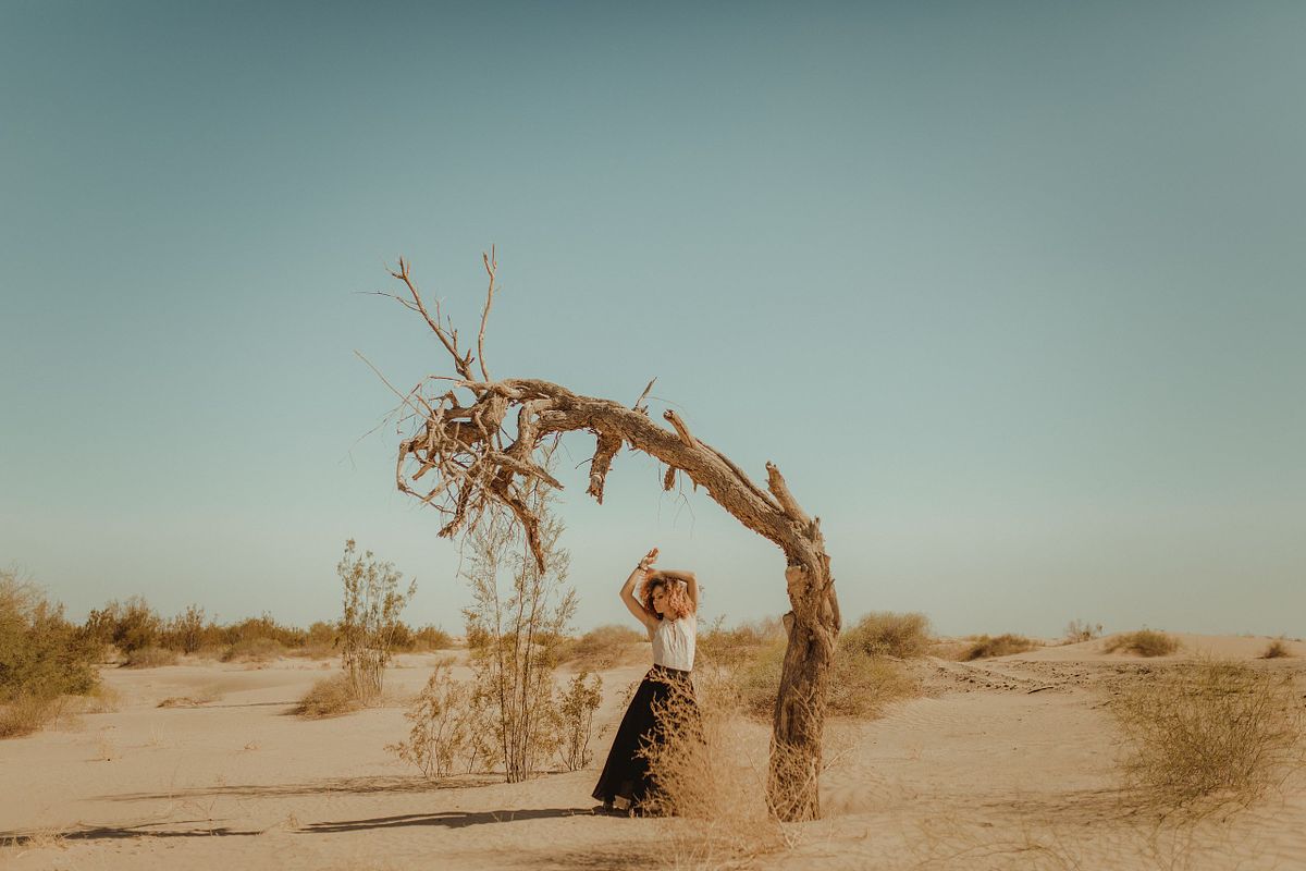 High-fashion portrait session in the Yuma sand dunes, editorial and bold.