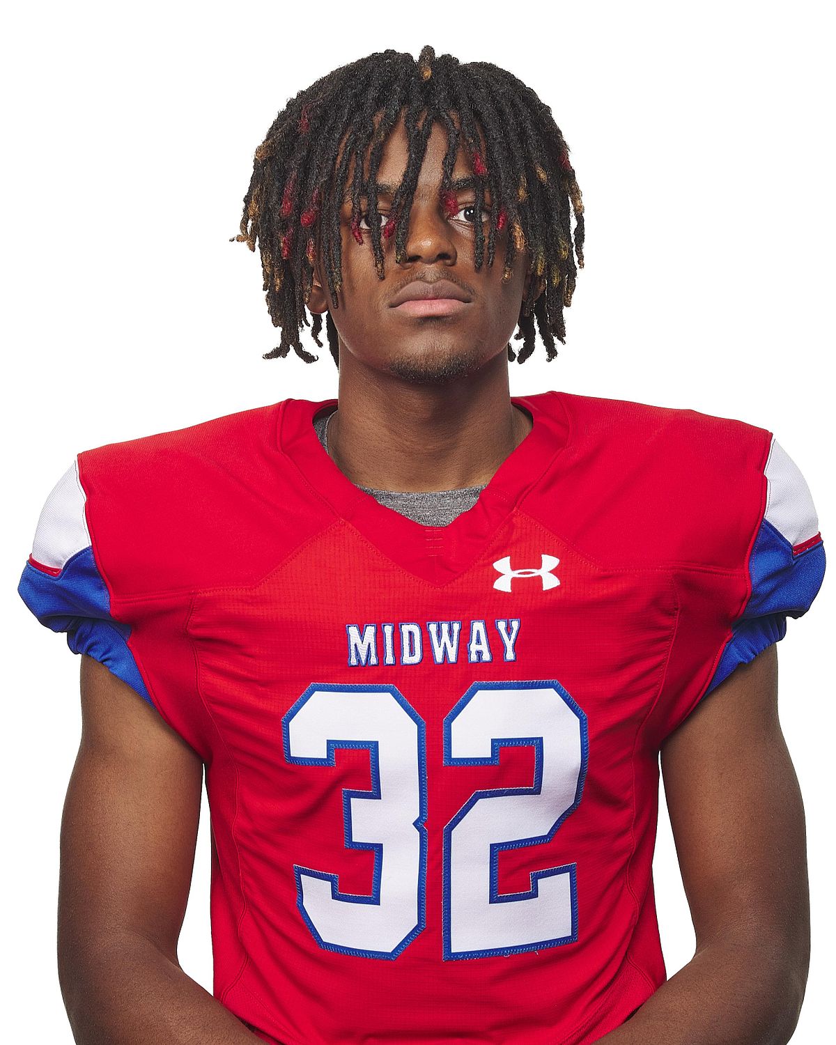 Headshot of a Midway high scho0l football player wearing their red jersey and pads.