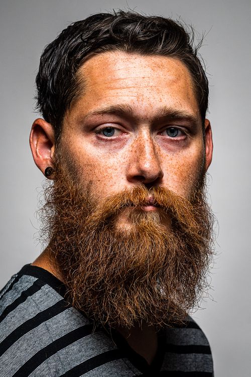 Half‑body studio portrait of Tim with strobe lighting on white background — editorial portrait by David Andrade, Las Vegas