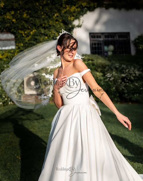 Wedding by Jermaine – bride spinning with her veil flowing in the air during her wedding day
