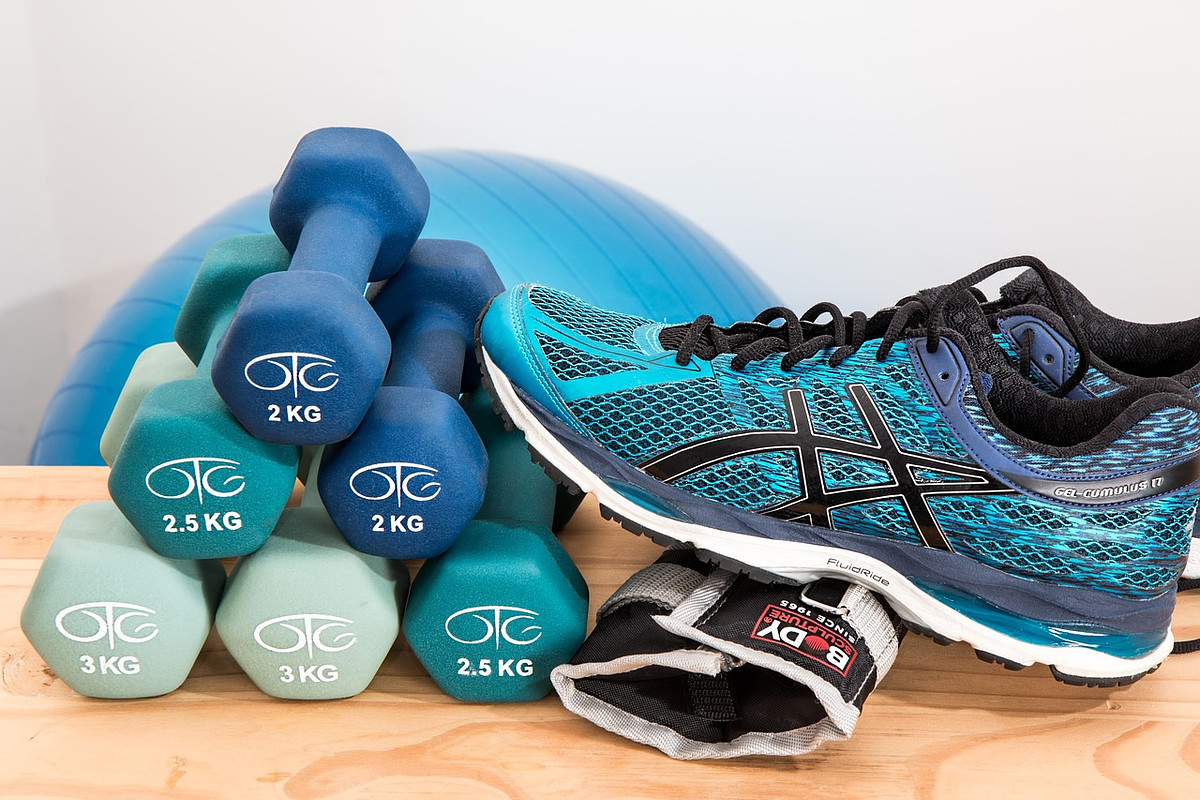 dumbbells and sneakers exercise equipment
