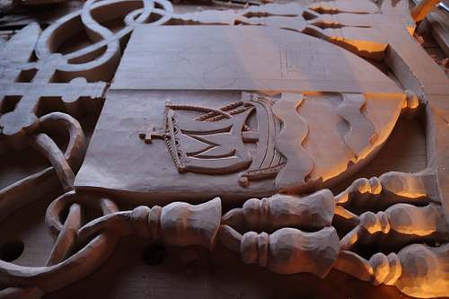 Santa Maria carving finished on dexter side of escutcheon