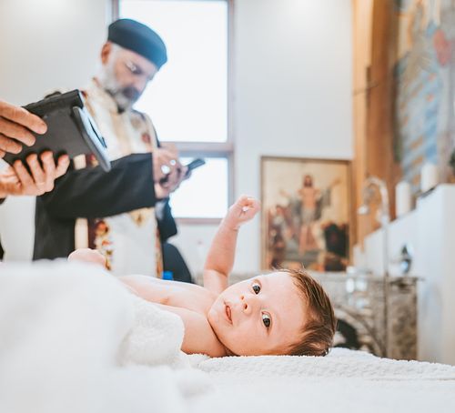 baby baptism ceremony at Ottawa church captured by Kameel Photography