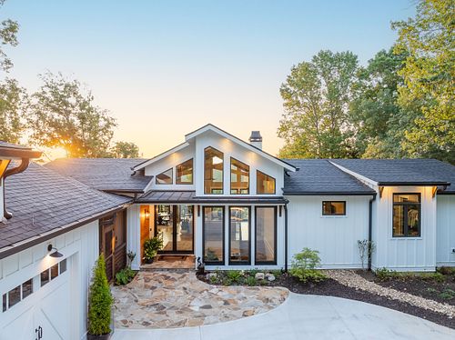 Overall View of Entry with the sun visible through the trees