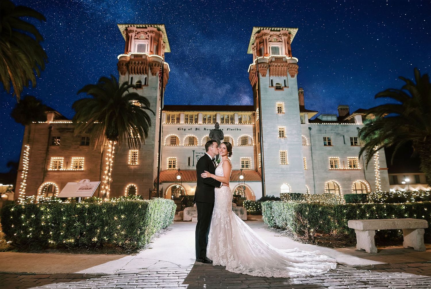 Stunning night wedding portrait at Lightner Museum St. Augustine with architectural lighting; luxury photography services in Jacksonville and North Florida by Legacy of Love.