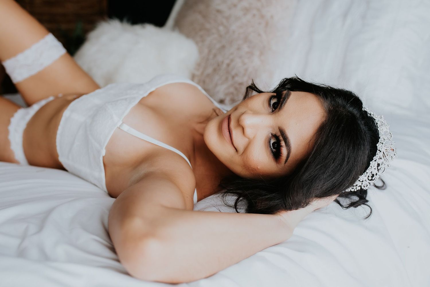 Bridal boudoir session in private studio near Willcox, Arizona &ndash; soft lighting and elegant lace robe.