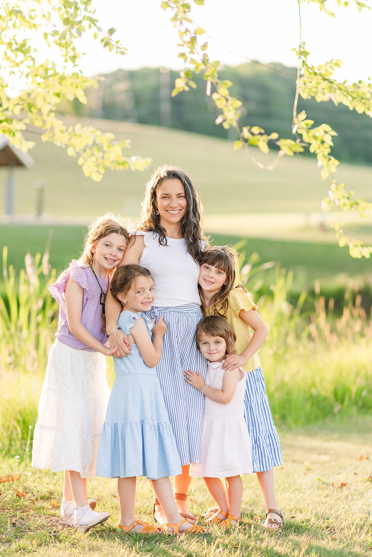 Cranberry Township Community Park mother with her four girls in neutral colored clothing and golden hour light