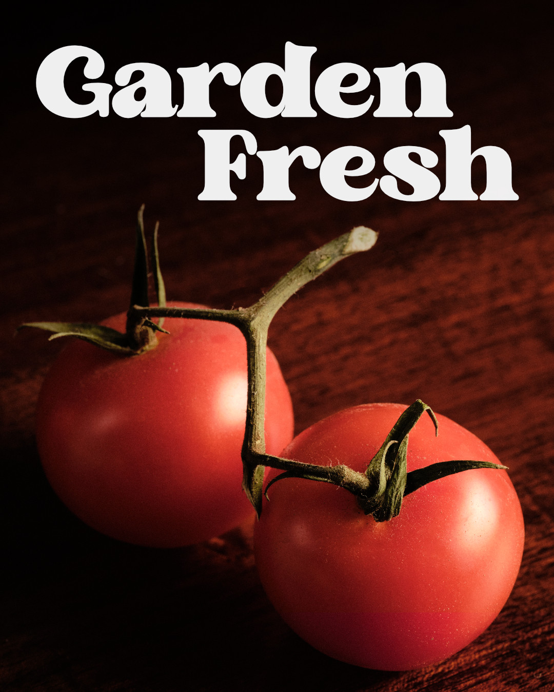 Two on the vine red tomatoes with a text overlay.