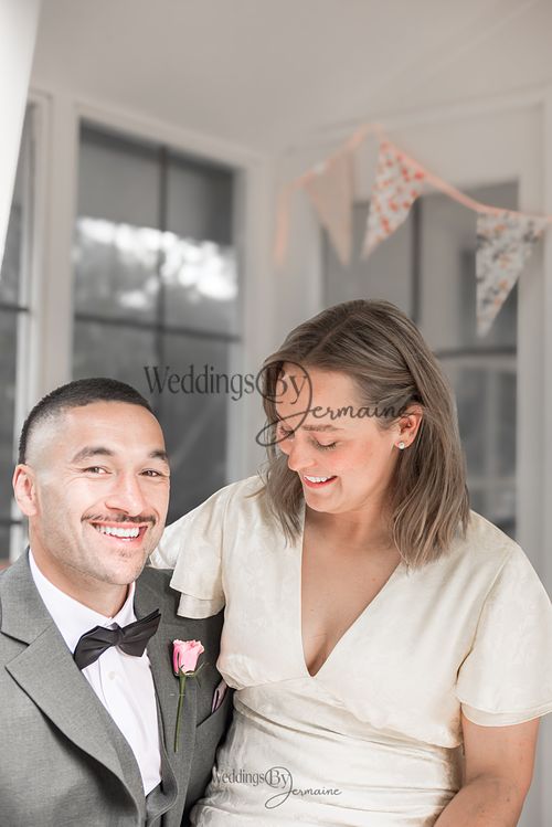 Bride-and-groom-listening-to-officiant-at-Oakham-Registry-Office