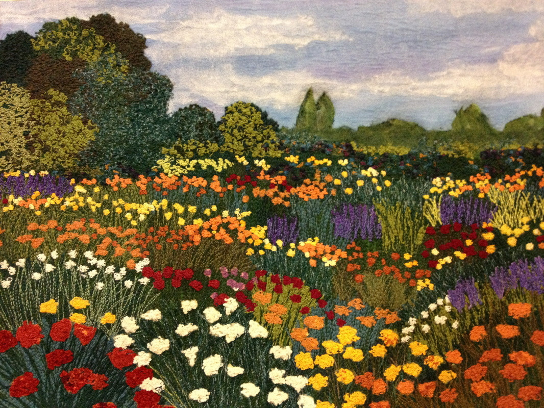 Fiber painting of a summer scene with flowers and blue sky by Susan Levi-Goerlich