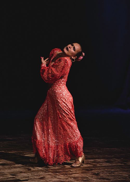 Flamenco teacher performing at a dance school concer