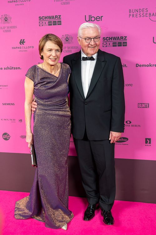 German President Frank-Walter Steinmeier and his wife posing on the pink carpet at Bundespresseball 2024.