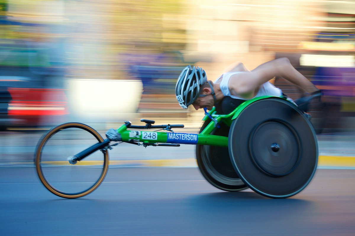 athlete in a racing wheelchair