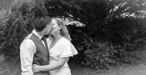 Bride-and-groom-listening-to-officiant-at-Oakham-Registry-Office