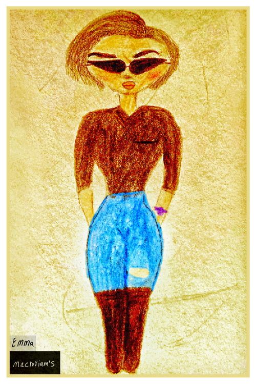 A woman with short hair and sunglasses stands confidently wearing a brown top and ripped blue jeans. She has her hands casually in her pockets.