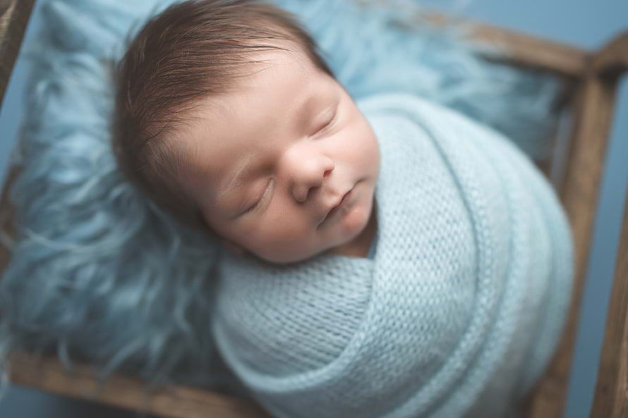 Beautiful baby boy sleeping peacefully captured by Spring Newborn Photographer
