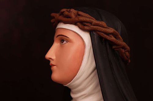 Saint Catherine Statue after repainting and restoration by Contrasts Woodcarving