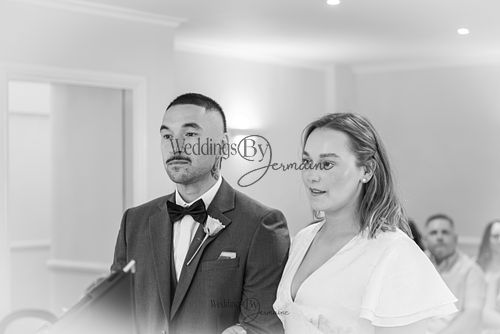 Bride-and-groom-listening-to-officiant-at-Oakham-Registry-Office