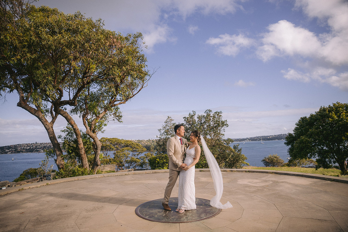 Joyful photo of bride and groom at Georges Head Lookout, adjacent to Gunners Barracks