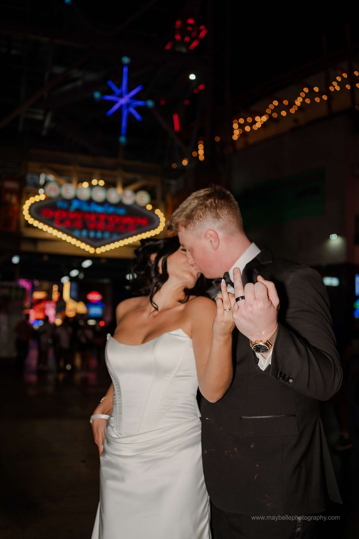 Romantic elopement photos at Carousel Bar in Downtown Las Vegas with couple celebrating with champagne