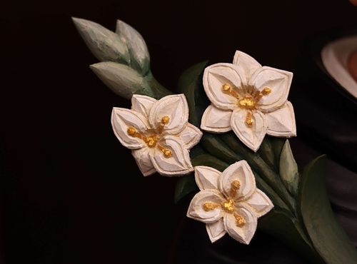 A detail of the hand-carved lilies for the St. Dominic Statue restoration for Holy Trinity Catholic Church in Somerset, Ohio