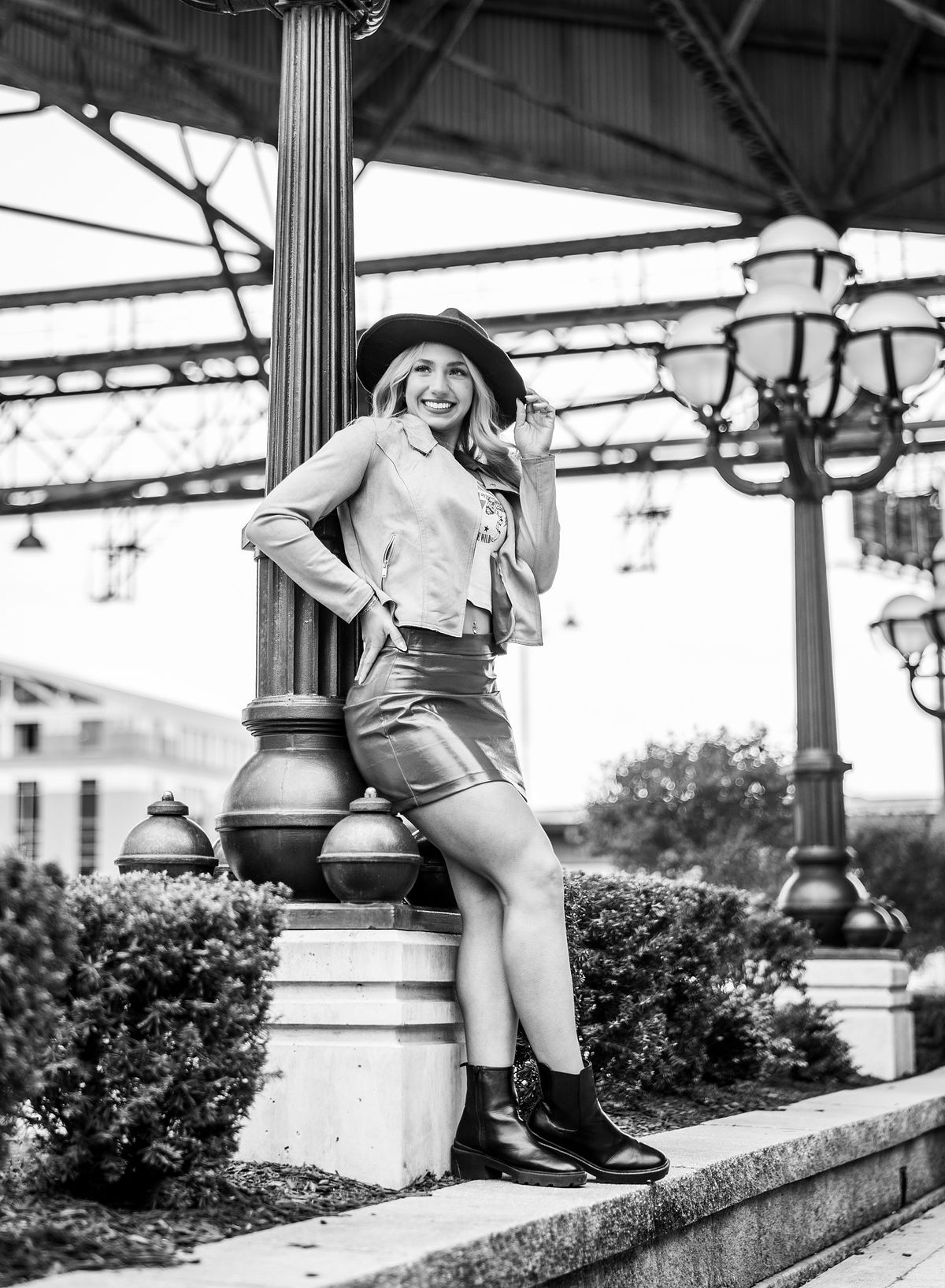High school senior posing outdoors with natural light.