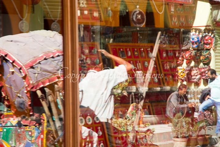A rickshaw weaving through the bustling Durbar Square, reflecting the lively essence of Kathmandu.