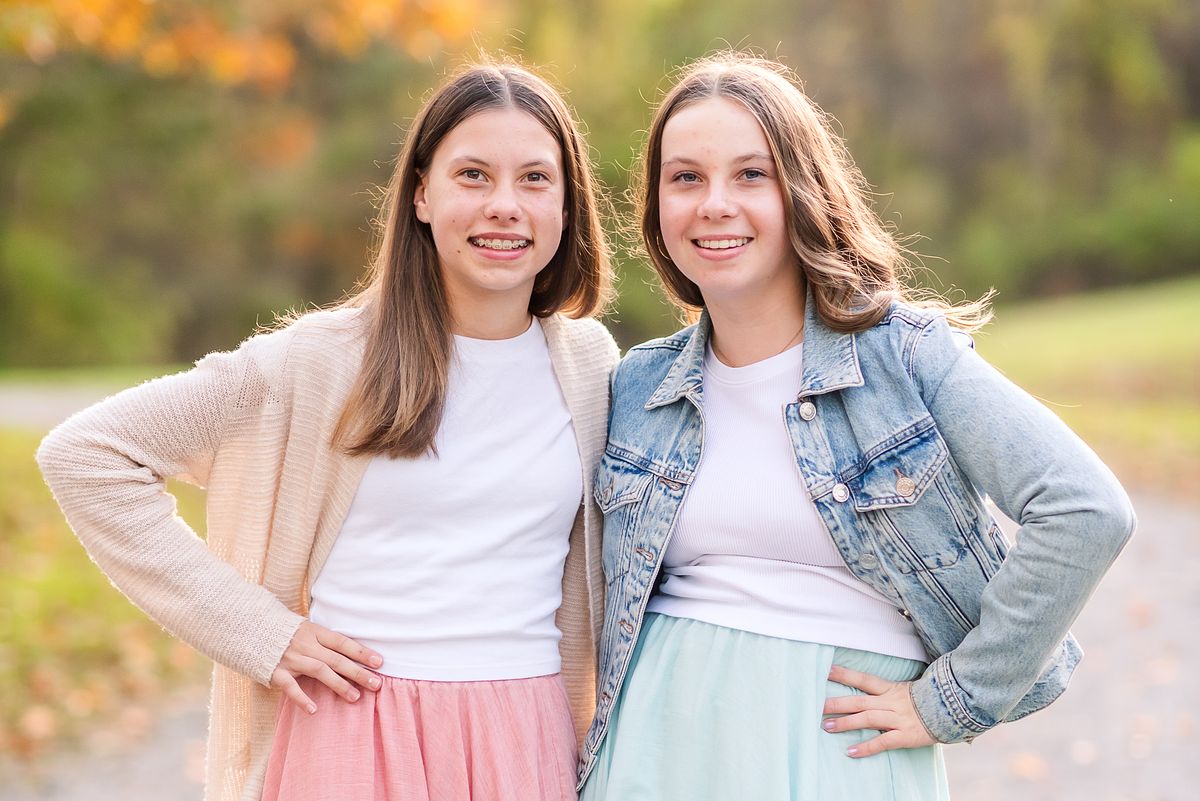 Two teen girls in neutral colors at golden hour with Cranberry Township, PA newborn photographer